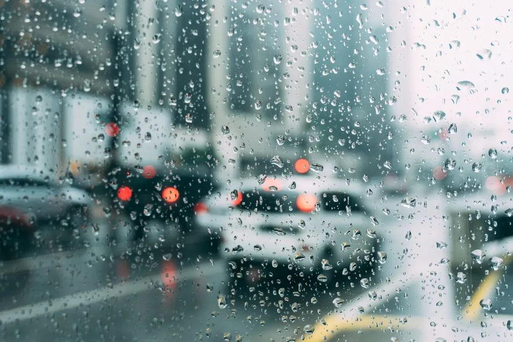 Raindrops beading on well-sealed window glass